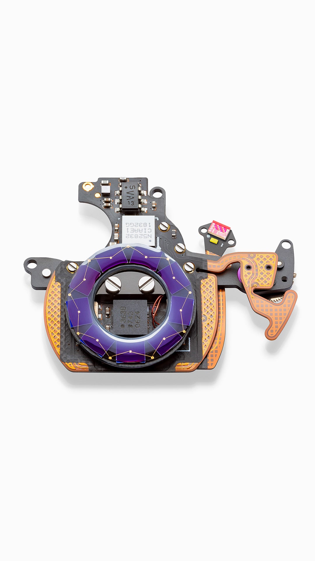 Ressence eCrown® electronic component powering the dual time zone of the TYPE 2 with purple and gold design on a white background 