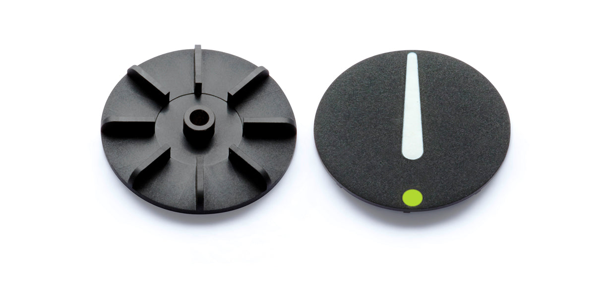 Ressence's hydraulic shock absorber component for oil-filled watches shown on the left from the inside, and on the right as seen on the dial, on a white background, mobile image