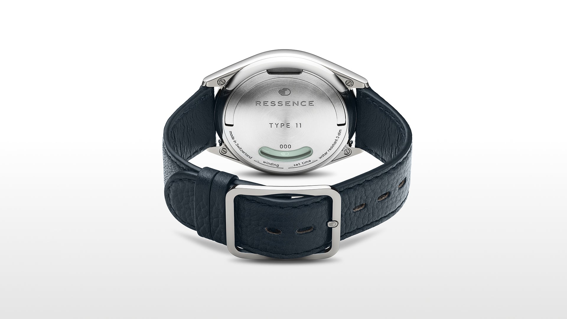View of the caseback of a Ressence TYPE 11 contemporary watch with blue leather strap and titanium case on a white background