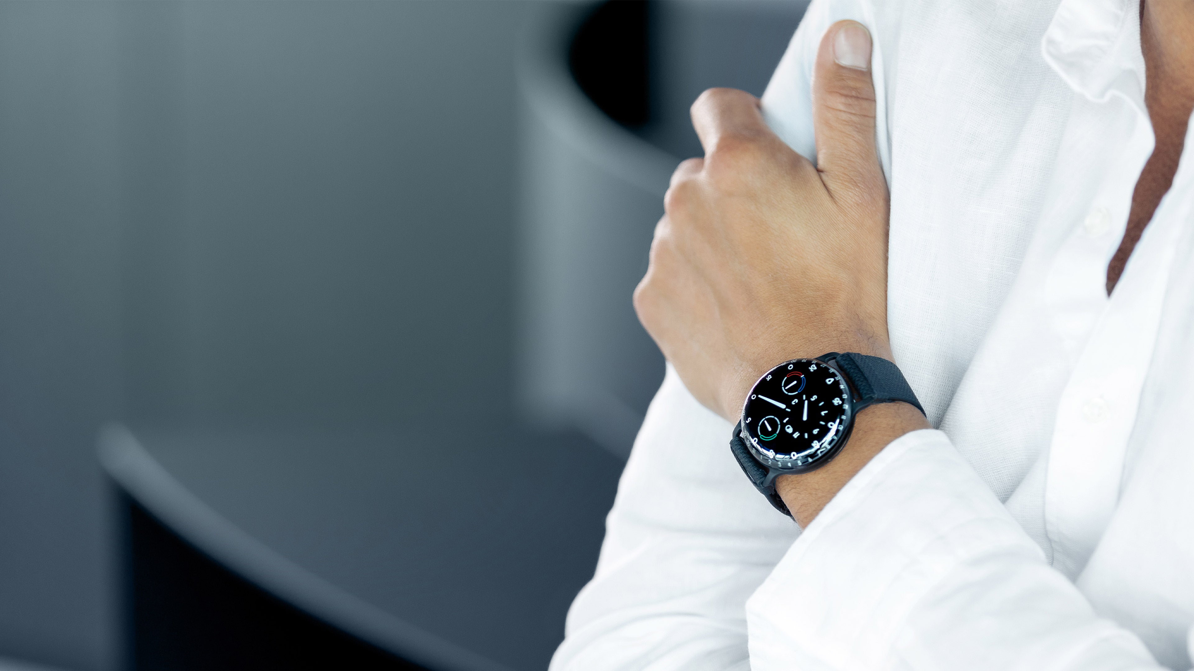 A lifestyle image of a Ressence TYPE 3 BB2, the award-winning high end oil-filled mechanical watch, shown on a man's wrist with a white shirt
