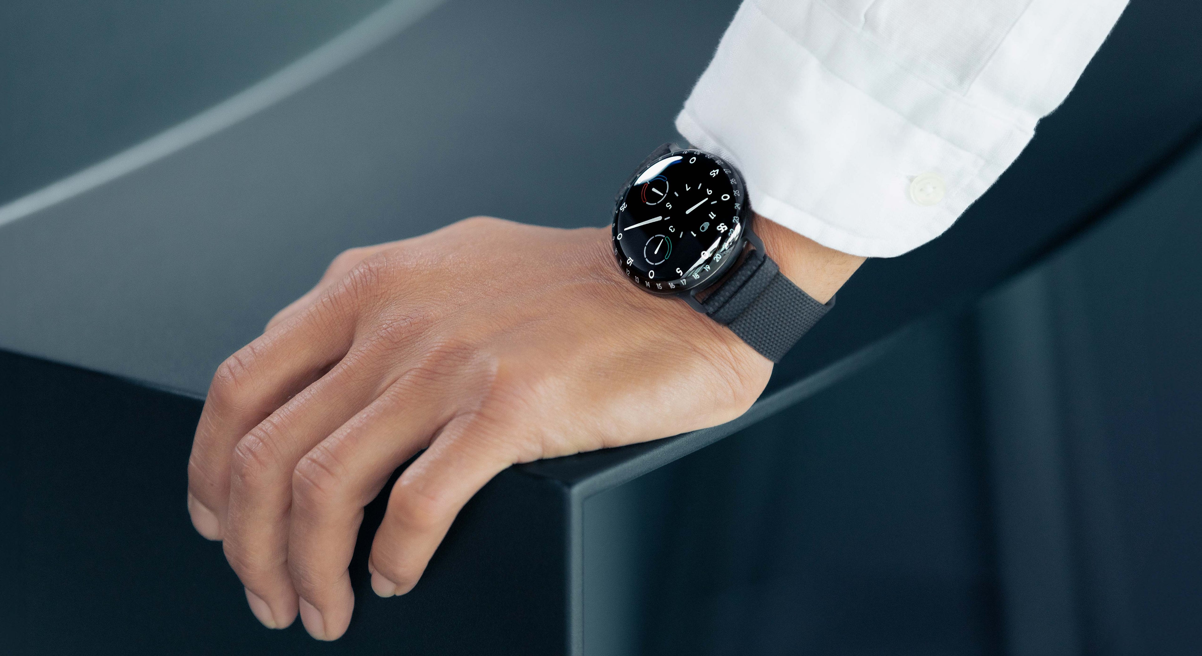 Ressence TYPE 3 BB2, the high end oil-filled mechanical watch, shown on a man's wrist with a white shirt