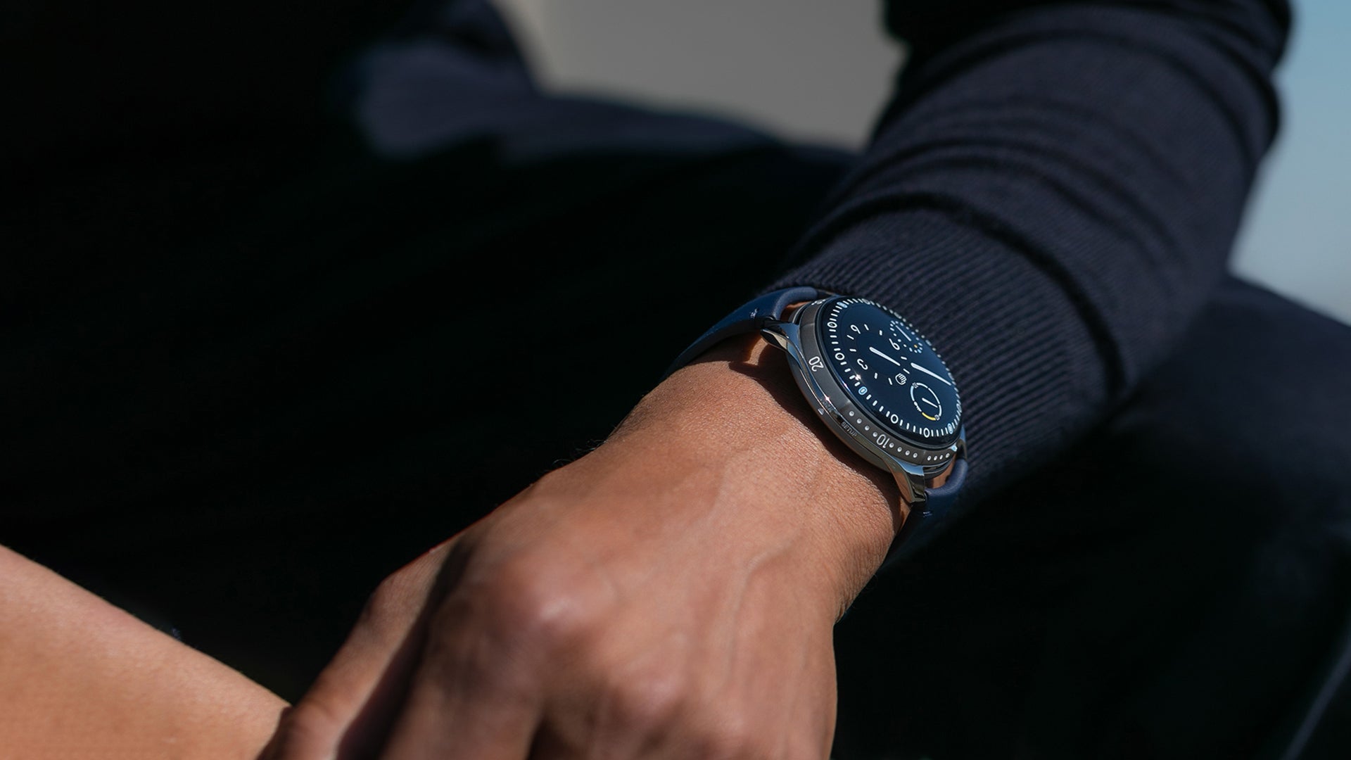 Ressence TYPE 5 Night Blue, an oil-filled diving watch, shown on a man's wrist