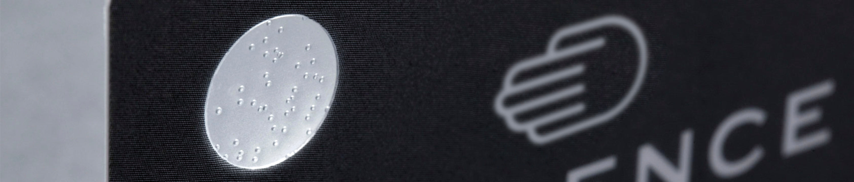 A close up image of the bubble tag on a Ressence Warranty card